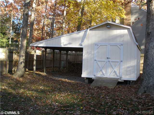 10751 Timberun Road Chesterfield, VA 23832 - Photo 10 of 10 a view of a small house with yard