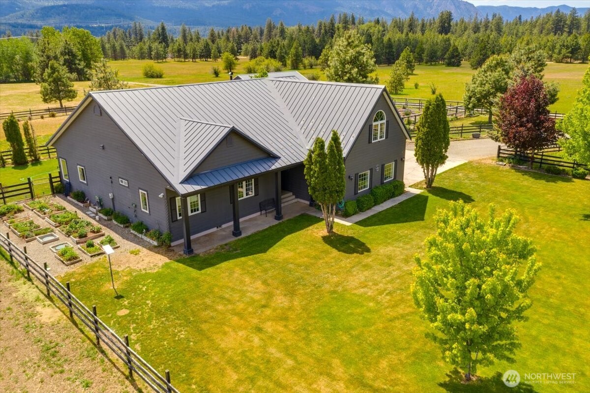 644 Masterson Road Cle Elum, WA 98922 - Photo 2 of 40 a view of a house with pool and a yard