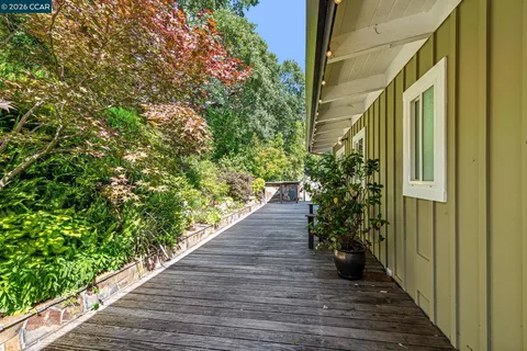 a view of a chairs and table in the patio