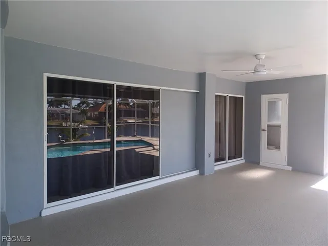 a white toilet sitting next to a white wall