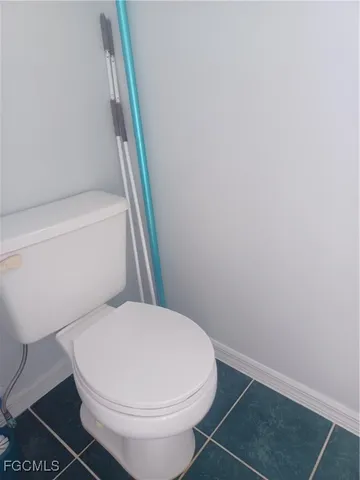 a view of a chairs and table in the patio