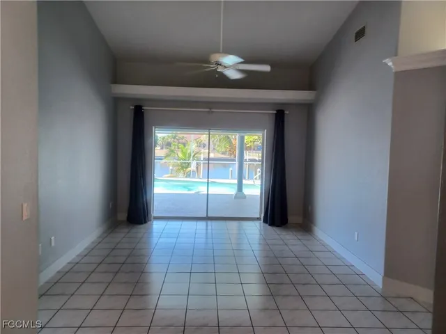 a view of an empty room and window