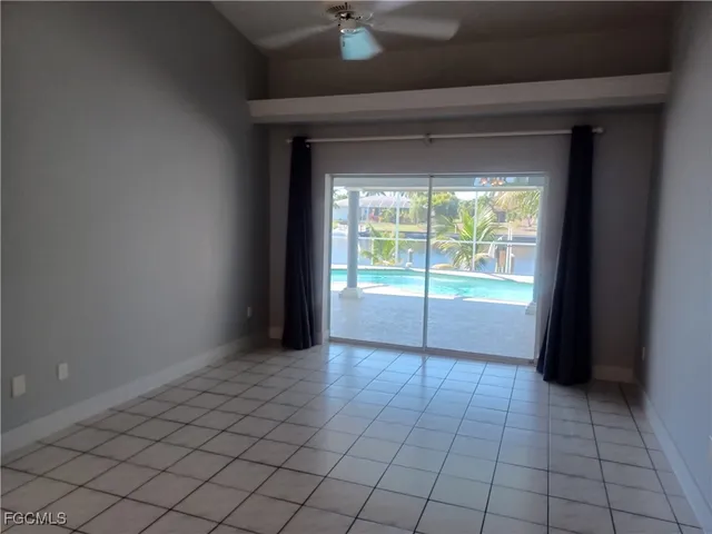 a kitchen with granite countertop a refrigerator and a sink