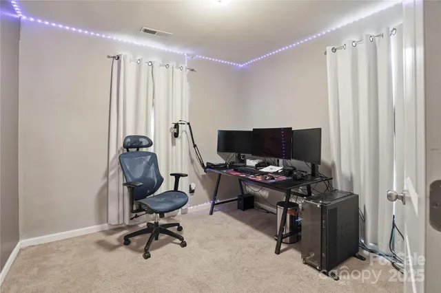 a view of a workspace with furniture