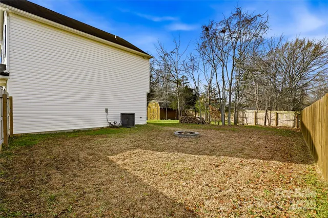 a view of a swimming pool with an outdoor space and seating area