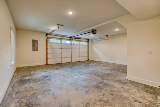 a bathroom with double vanity sinks and a mirror