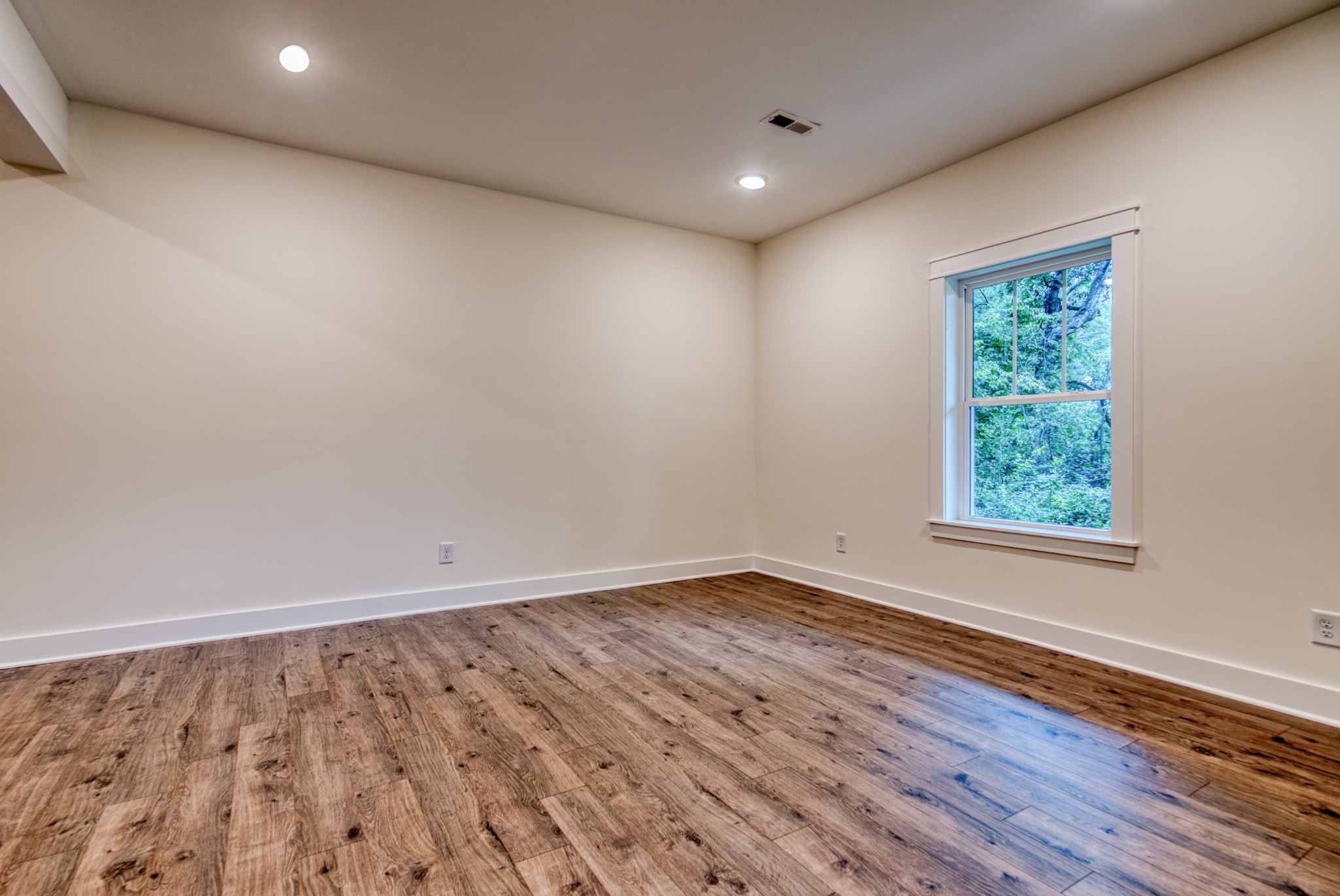 793 Spring Circle Springfield, TN 37172 - Photo 19 of 83 a view of an empty room with wooden floor and a window