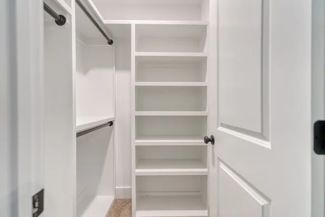 a bathroom with a shower and a mirror