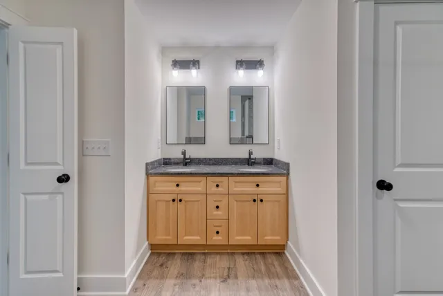 a kitchen with stainless steel appliances granite countertop a sink a stove a microwave and cabinets