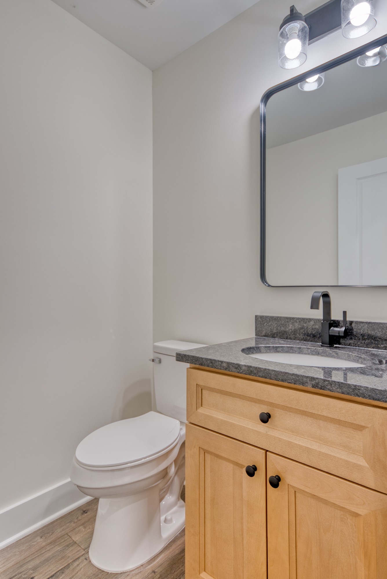 793 Spring Circle Springfield, TN 37172 - Photo 38 of 83 a bathroom with a granite countertop toilet sink and mirror