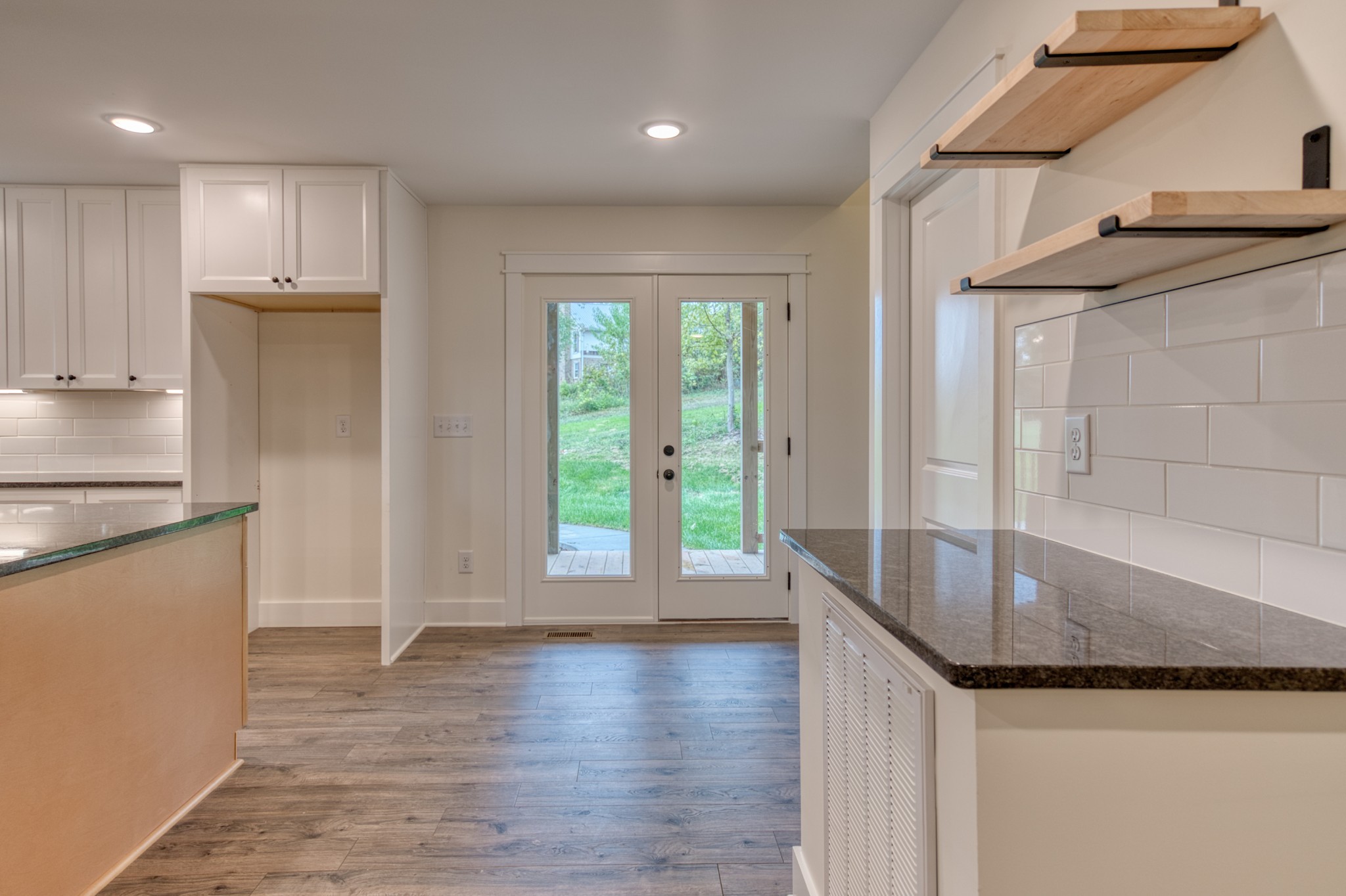 793 Spring Circle Springfield, TN 37172 - Photo 51 of 83 a kitchen with granite countertop a sink and a refrigerator