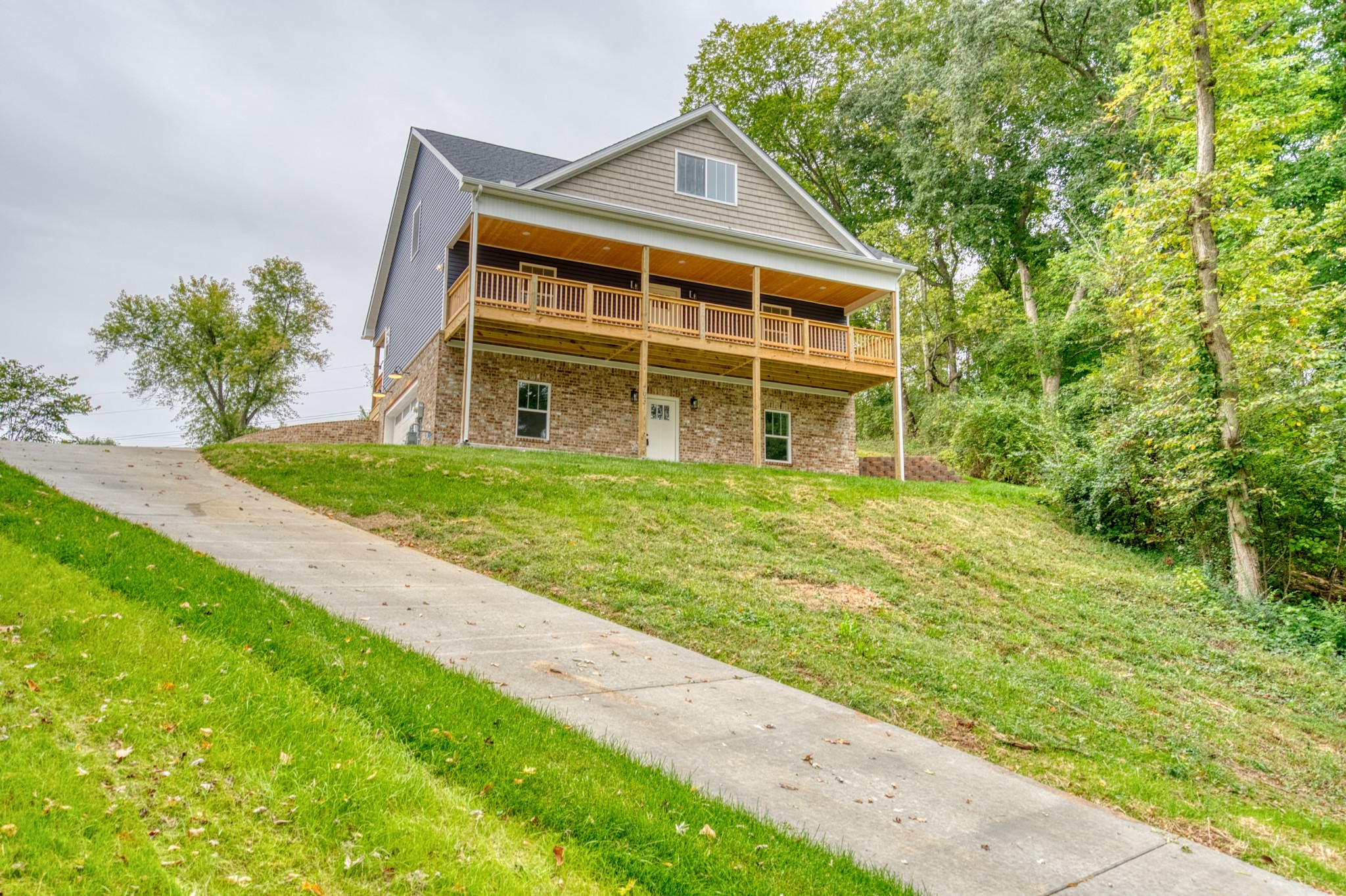 793 Spring Circle Springfield, TN 37172 - Photo 81 of 83 a front view of a house with a yard and trees
