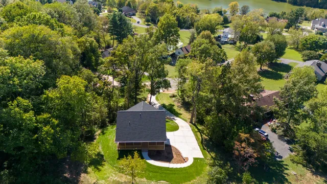 a view of a house with a yard and garage