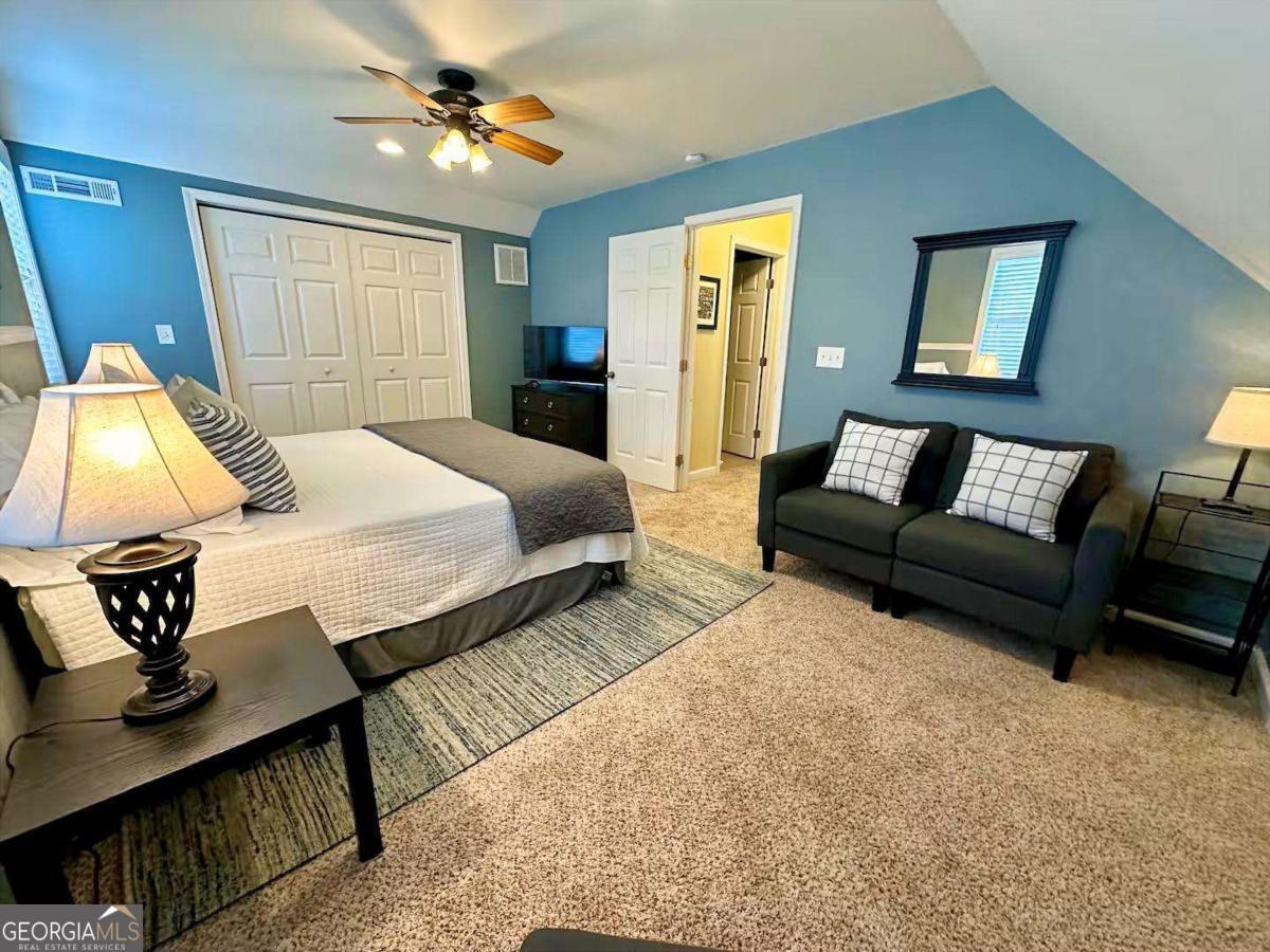 35 High Point Trail Blue Ridge, GA 30513 - Photo 13 of 18 a bedroom with a bed a couch and dresser