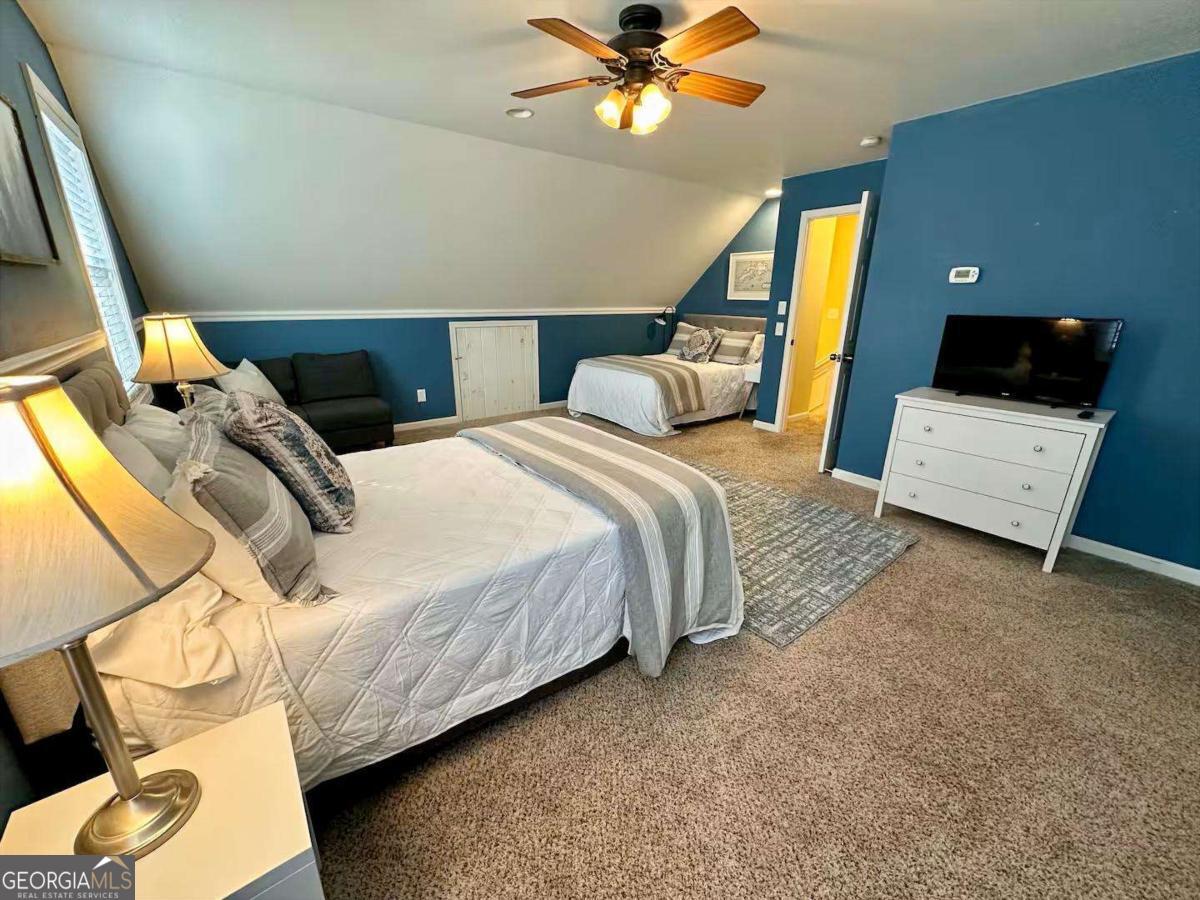 35 High Point Trail Blue Ridge, GA 30513 - Photo 14 of 18 a bedroom with a bed and a tv