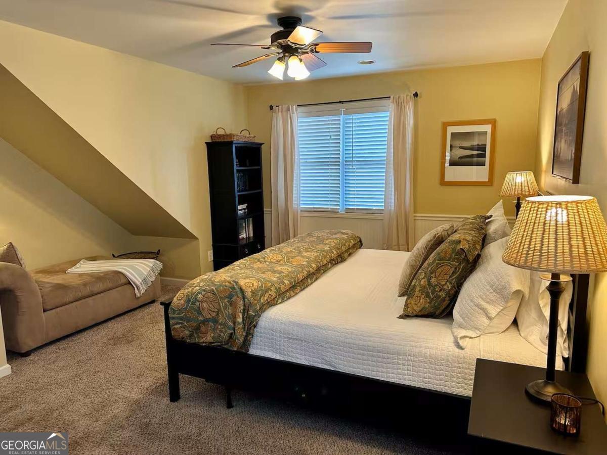35 High Point Trail Blue Ridge, GA 30513 - Photo 7 of 18 a bedroom with a bed and a couch