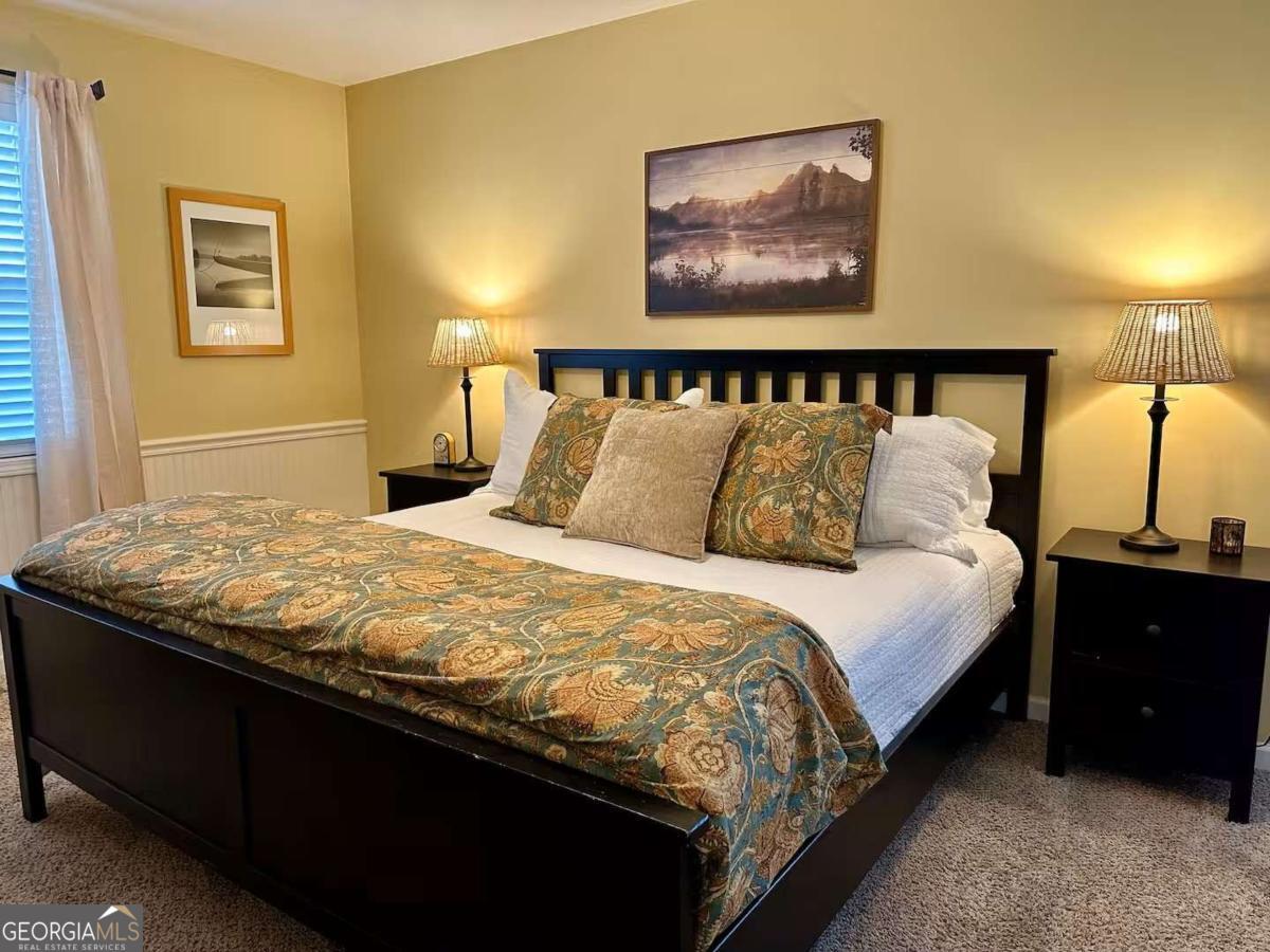 35 High Point Trail Blue Ridge, GA 30513 - Photo 9 of 18 a bedroom with a bed and a painting on the wall