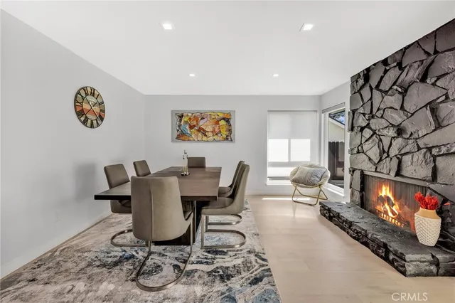 a work room with furniture and a flat screen tv