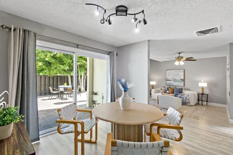a view of a dining room with furniture window and outside view
