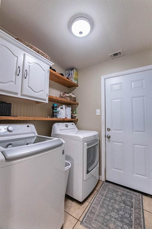 10336 Jennifer Circle Forney, TX 75126 - Photo 28 of 37 Here is the utility room with built-in cabinets and shelving. Conveniently located on the first floor close to the Primary Bedroom.