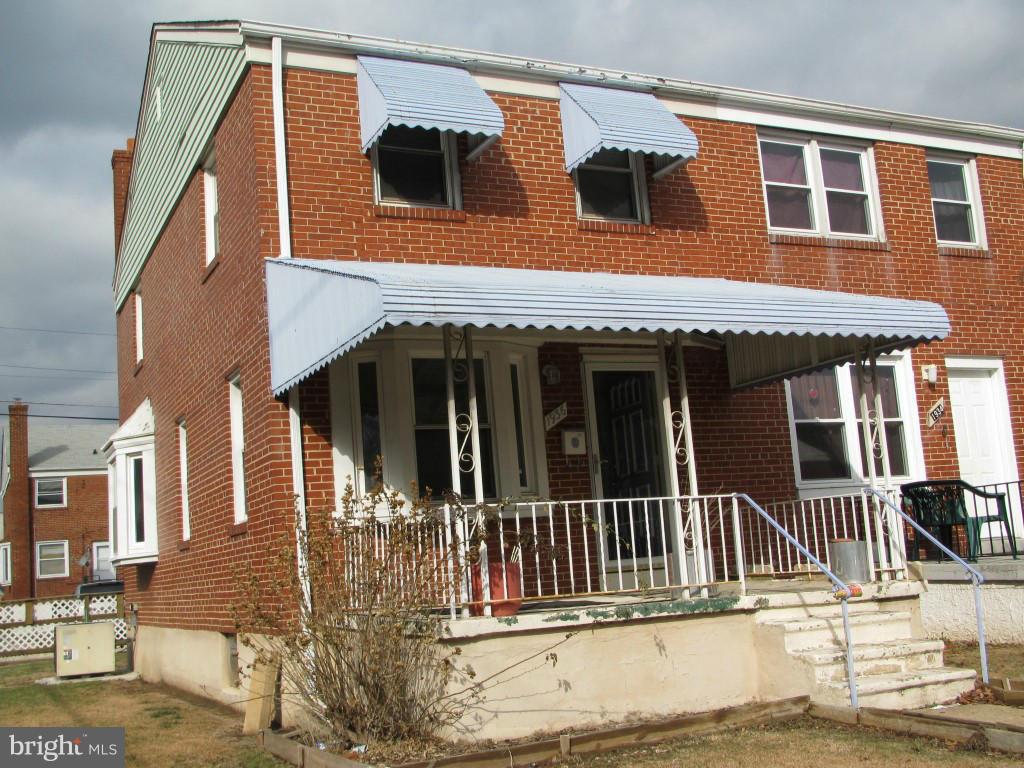 1936 Penhall Road Baltimore, MD 21222 - Photo 1 of 14 a view of a house with large windows