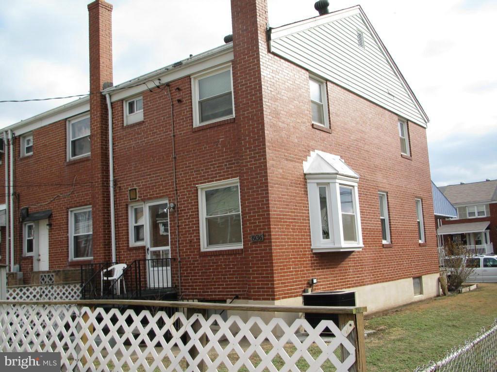 1936 Penhall Road Baltimore, MD 21222 - Photo 14 of 14 a front view of a house with a yard