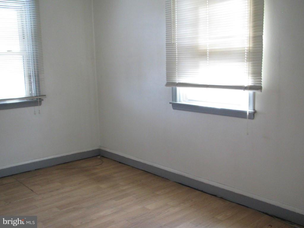 1936 Penhall Road Baltimore, MD 21222 - Photo 6 of 14 an empty room with a window