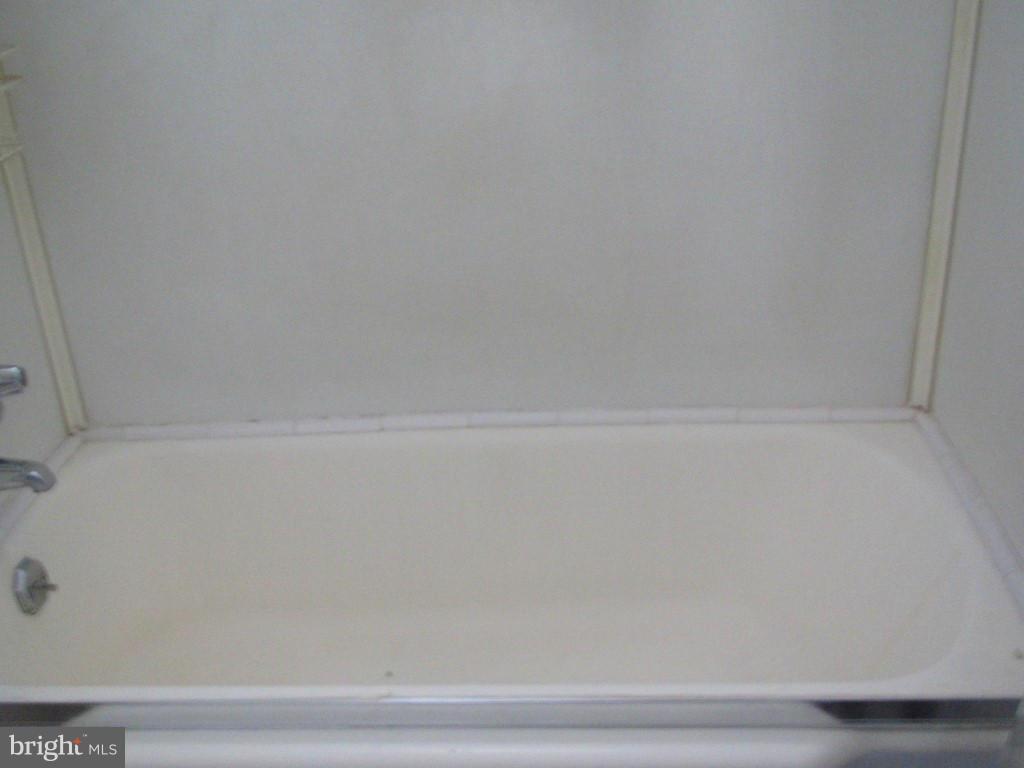 1936 Penhall Road Baltimore, MD 21222 - Photo 8 of 14 a close up of a bathtub