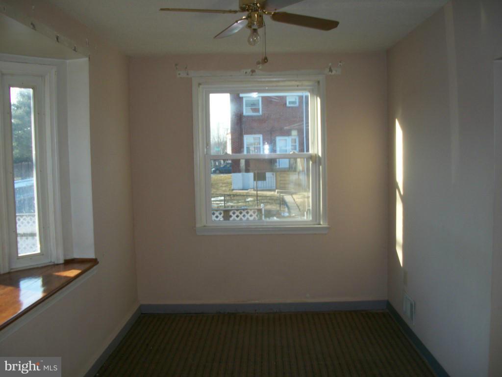 1936 Penhall Road Baltimore, MD 21222 - Photo 9 of 14 an empty room with a window
