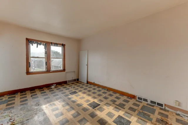 a view of an empty room and window