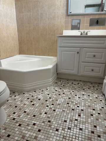a bathroom with a bathtub and a sink