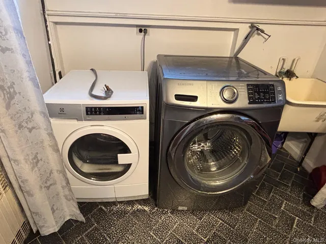 a utility room with dryer and washer