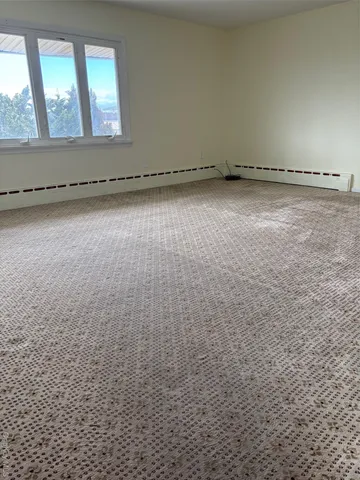 an empty room with a bench