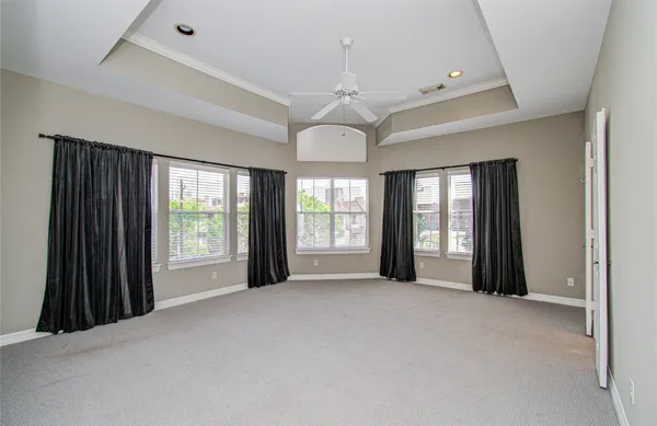 a view of a room with windows and chandelier