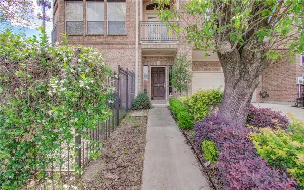 a front view of a house with a pathway