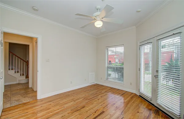 wooden floor in an empty room with a window