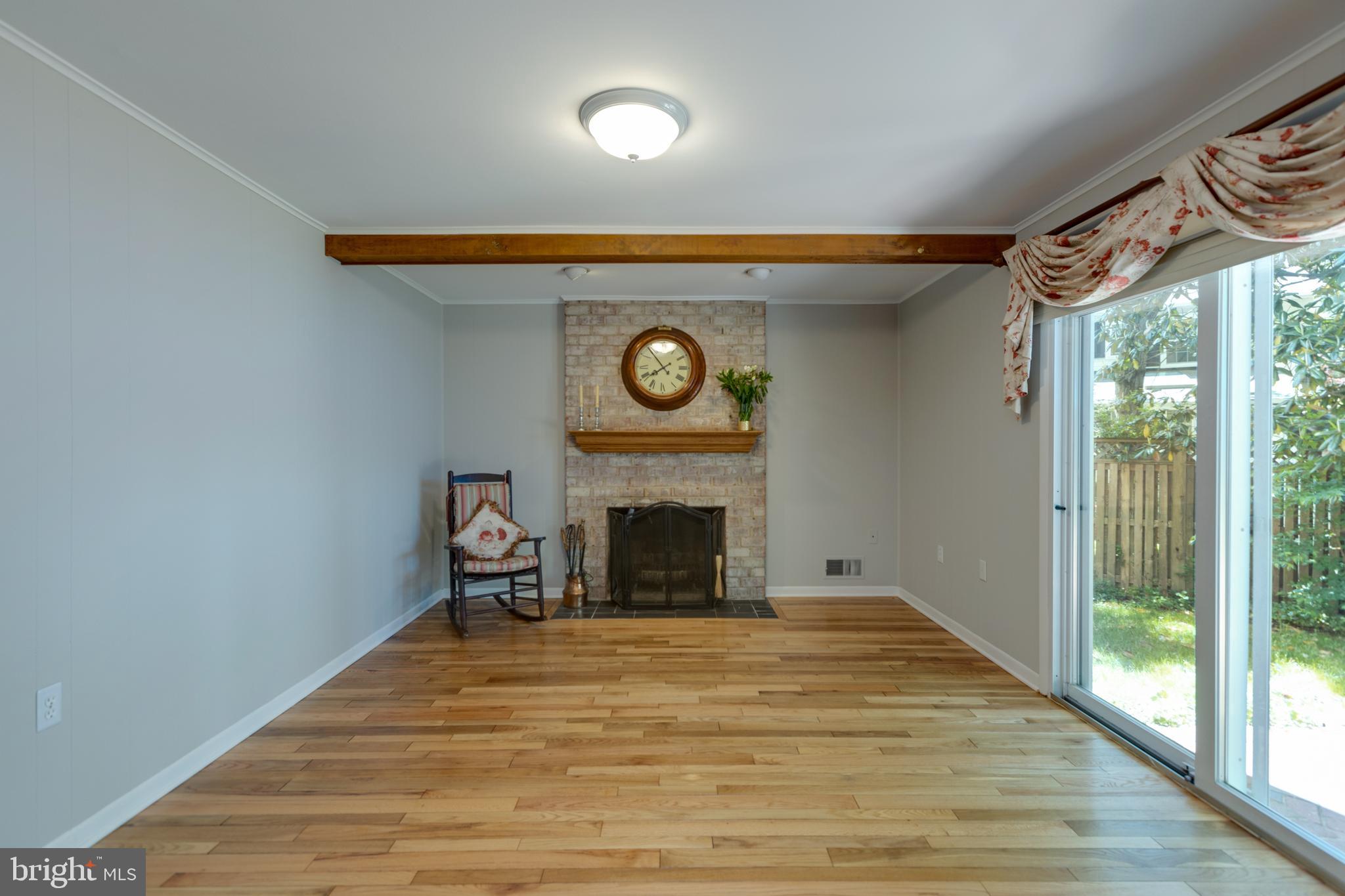 8238 Crown Court Road Alexandria, VA 22308 - Photo 23 of 57 Stone fireplace in family room