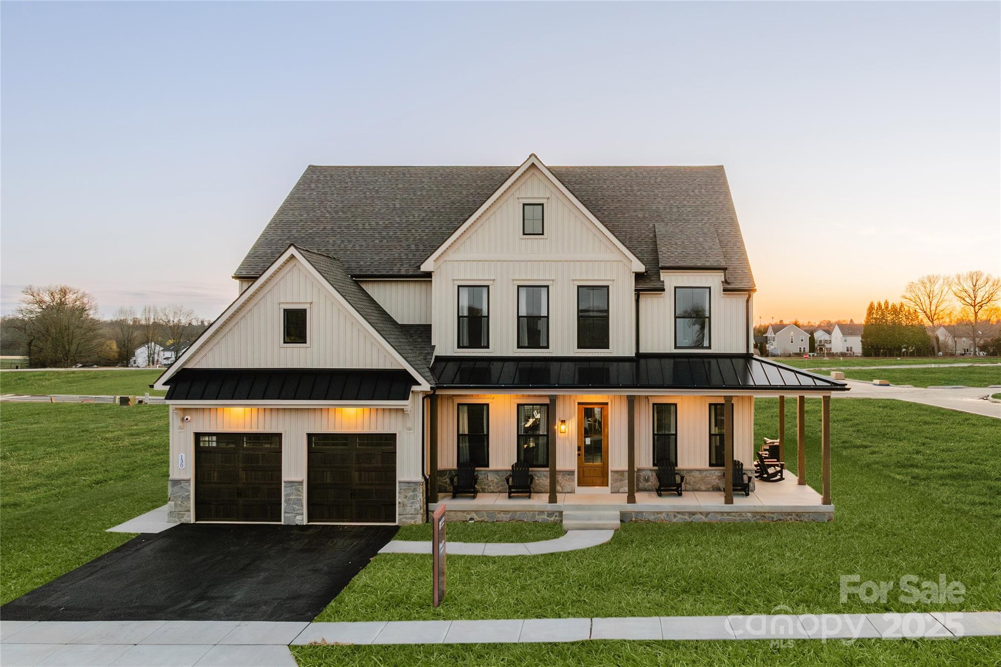 15 Huntersville-Concord Road, Unit DEVONSHIRE Huntersville, NC 28078 - Photo 4 of 48 a front view of a house with a yard