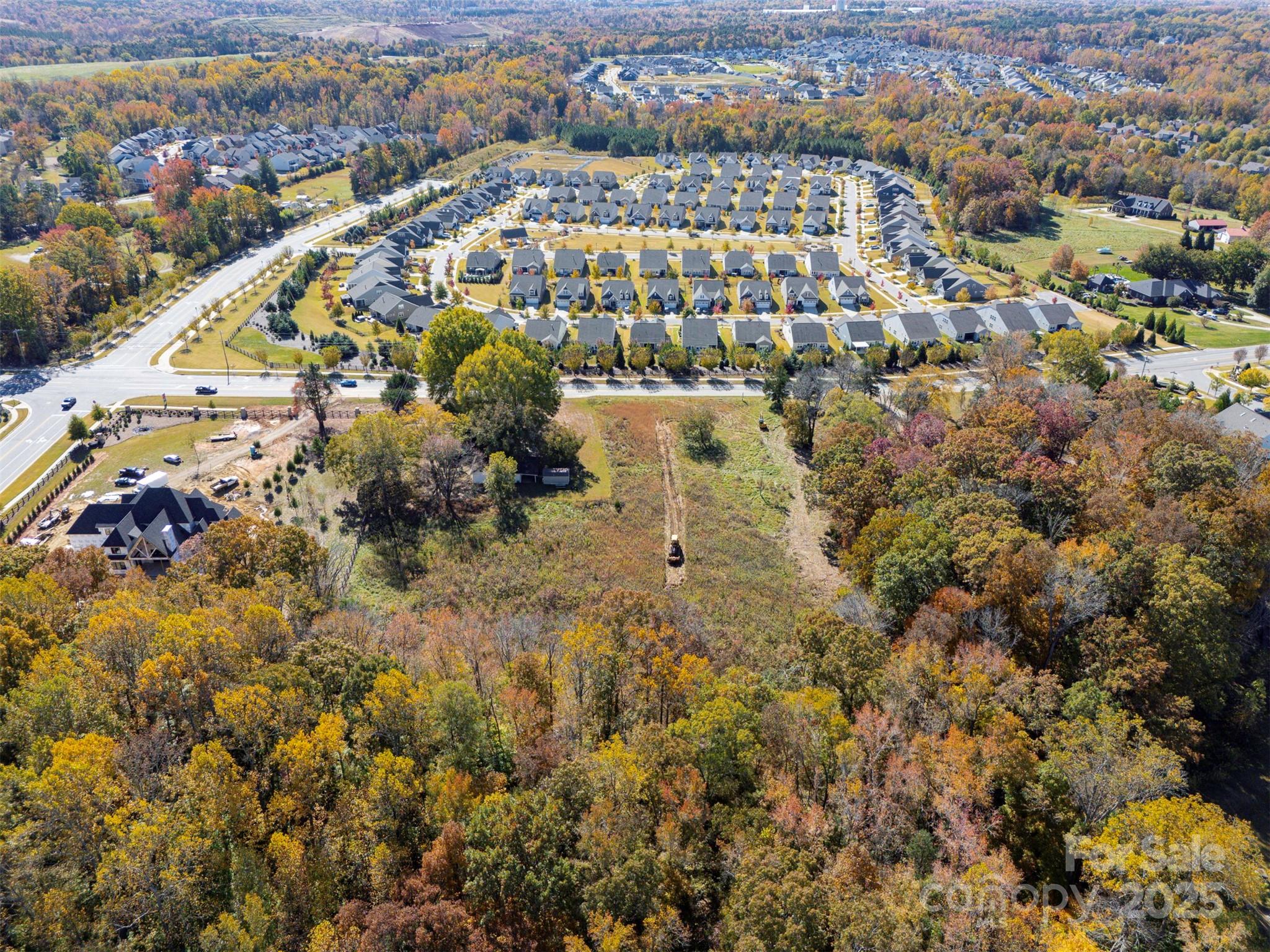 15 Huntersville-Concord Road, Unit DEVONSHIRE Huntersville, NC 28078 - Photo 48 of 48 an aerial view of residential building and parking space