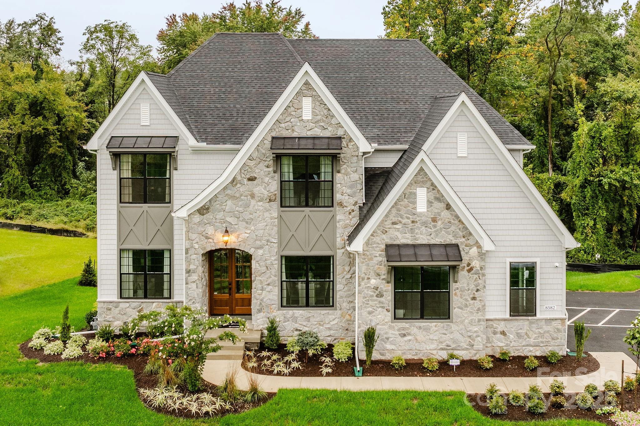 15 Huntersville-Concord Road, Unit DEVONSHIRE Huntersville, NC 28078 - Photo 6 of 48 a front view of house with yard and green space