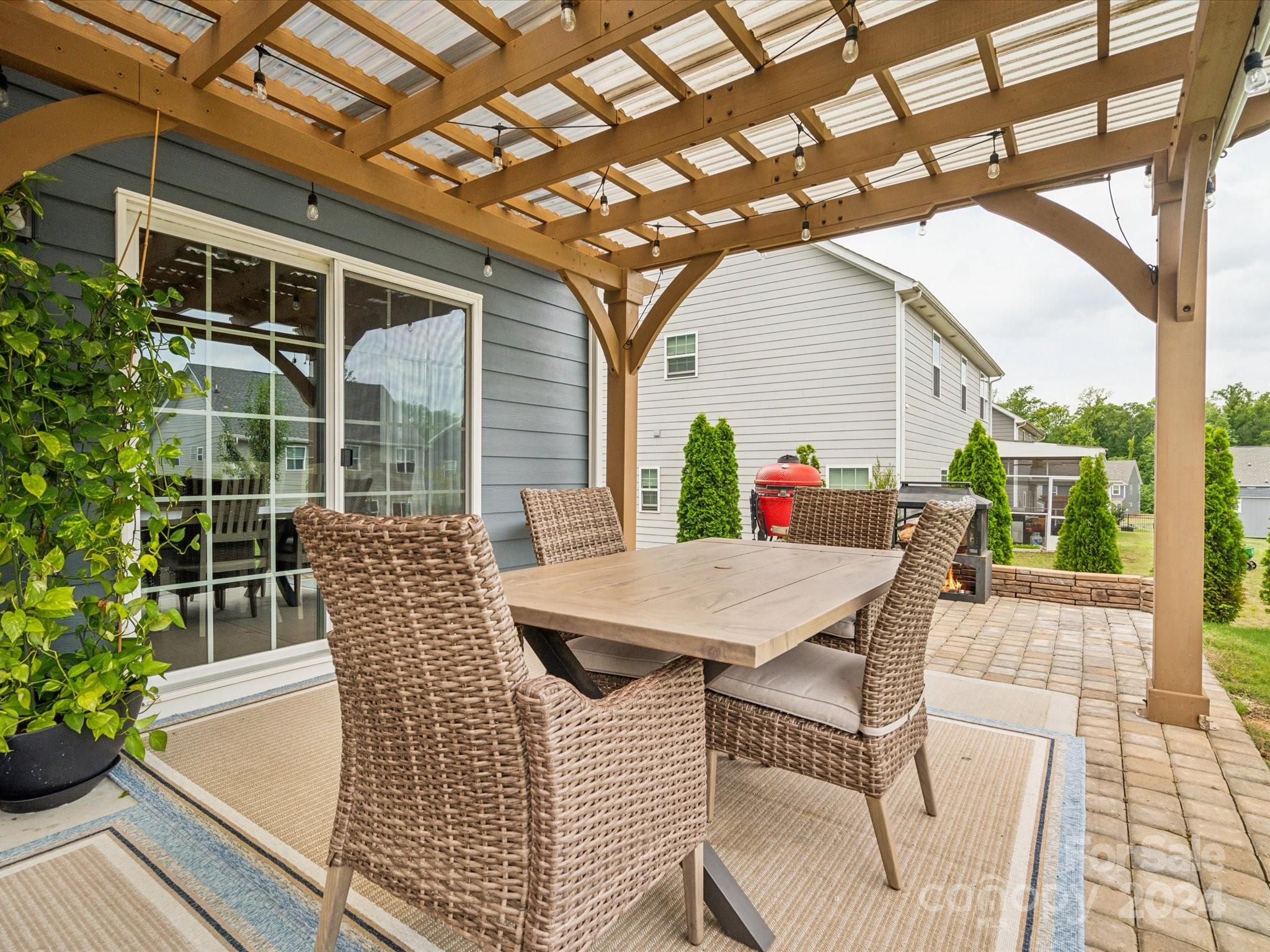 7114 Messina Road Indian Land, SC 29707 - Photo 34 of 40 a roof deck with table and chairs and potted plants