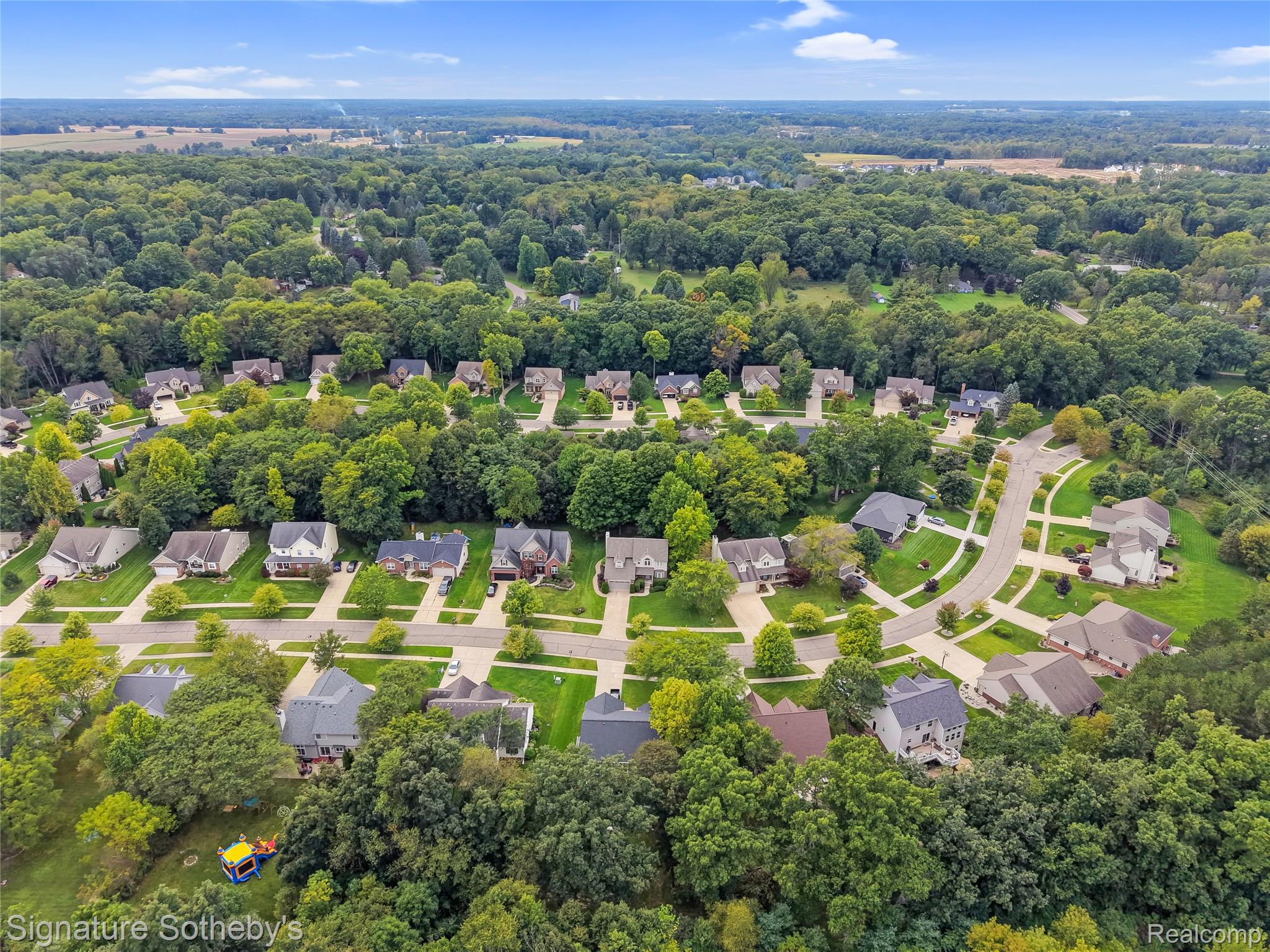 170 Fairhill Way Howell, MI 48843 - Photo 56 of 60 Aerial view showcasing the community with mature trees