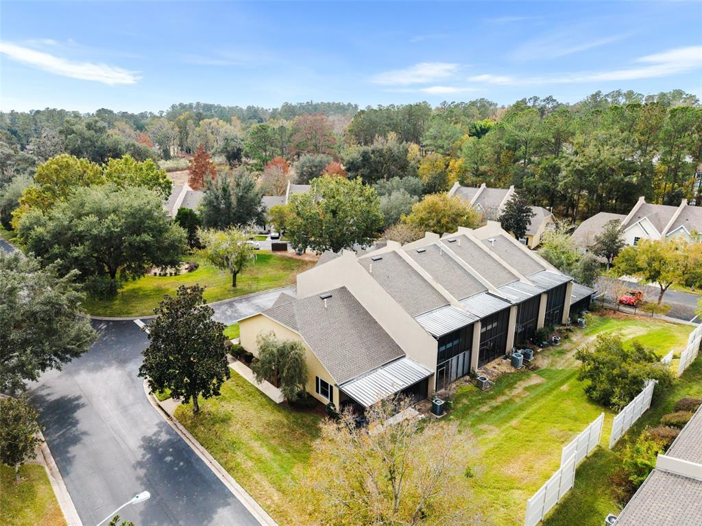 10510 Northwest 28th Place Gainesville, FL 32606 - Photo 27 of 40 a view of a house with big yard and large trees