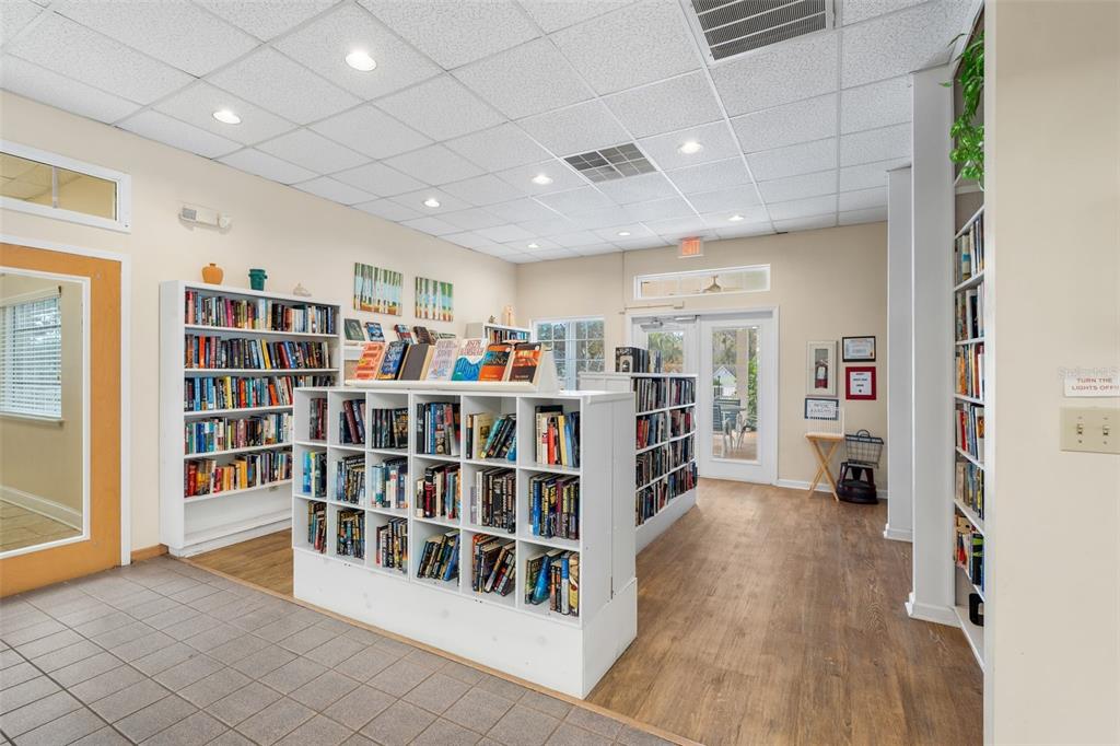 10510 Northwest 28th Place Gainesville, FL 32606 - Photo 32 of 40 a living room with lots of furniture and a book shelf