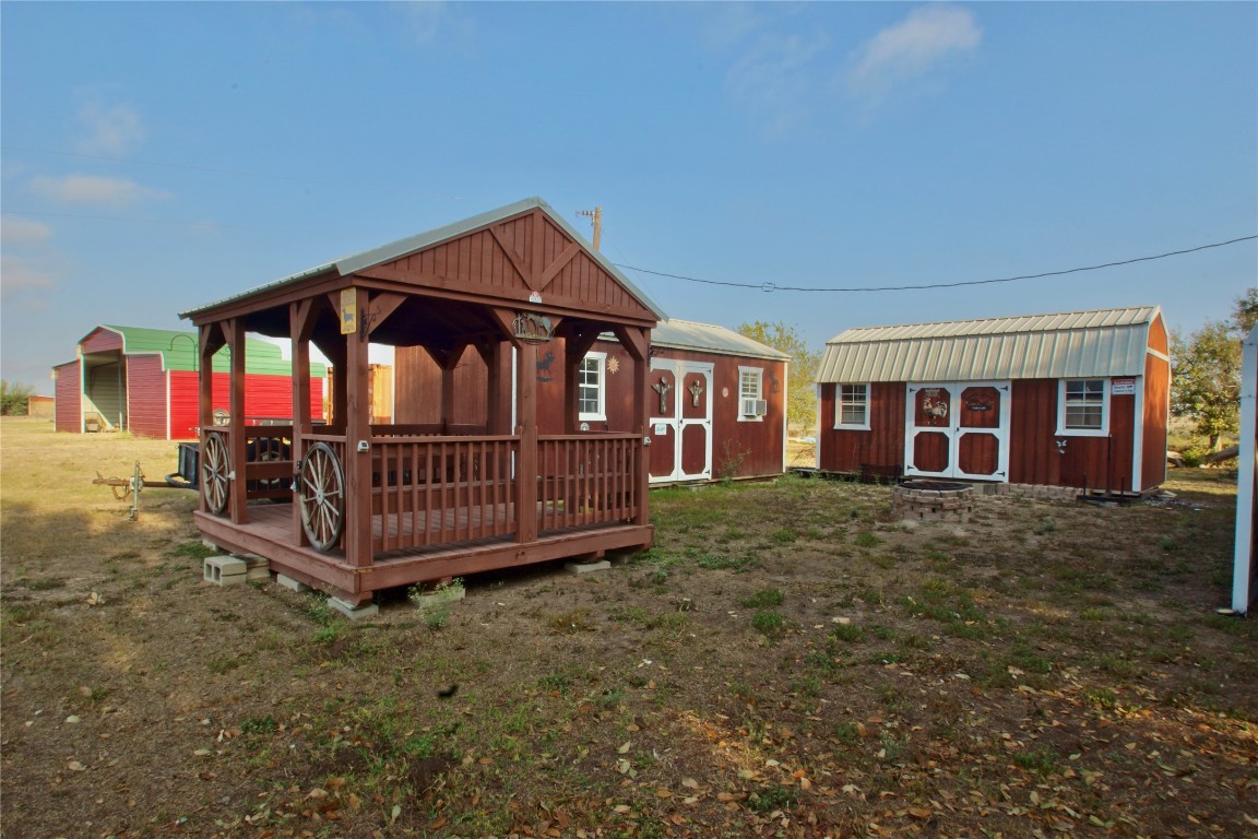1891 Dworaczyk Road Yorktown, TX 78164 - Photo 15 of 48 a view of a house with a yard and deck