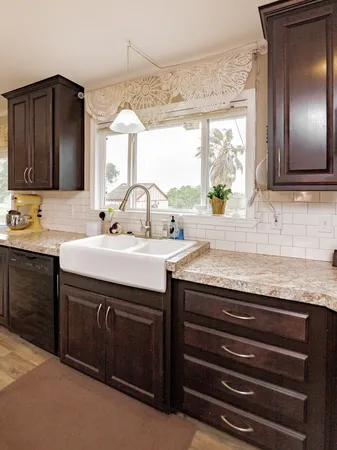 a sink with granite countertop a sink and a window