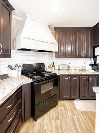 a kitchen with a sink and a stove