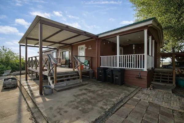 a view of porch with a bench