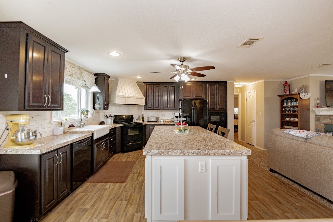 1891 Dworaczyk Road Yorktown, TX 78164 - Photo 32 of 48 a kitchen with a sink stove and refrigerator