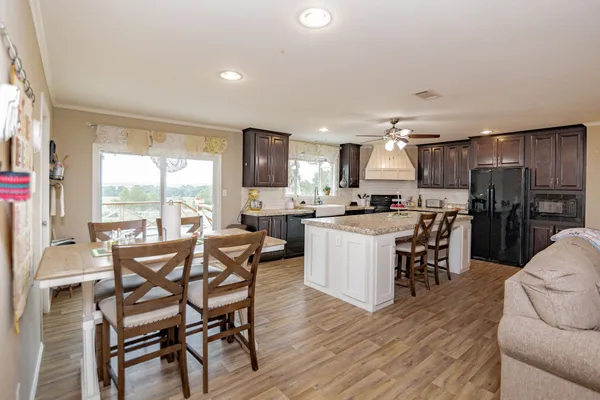 a view of a dining room with furniture window and outside view